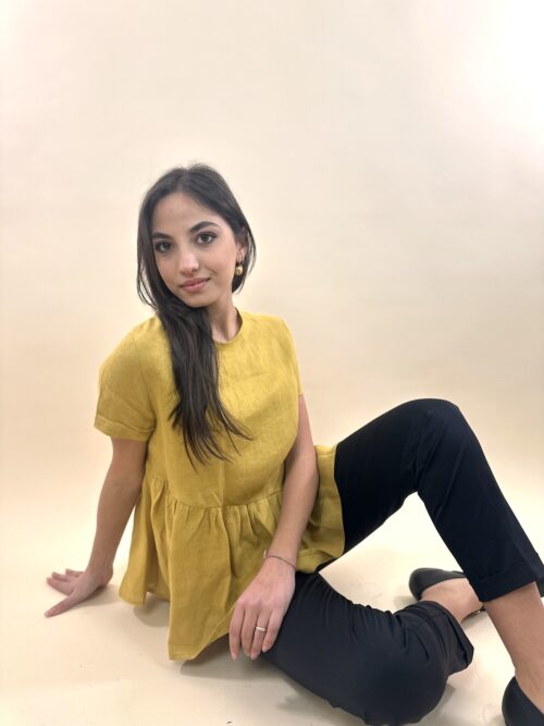 Woman Wearing Yellow Off-shoulder Top and Black Pants Sitting on